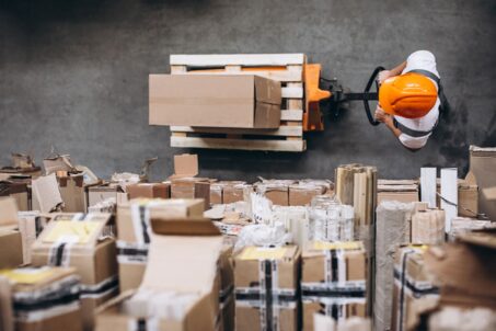 young-man-working-warehouse-with-boxes (1)