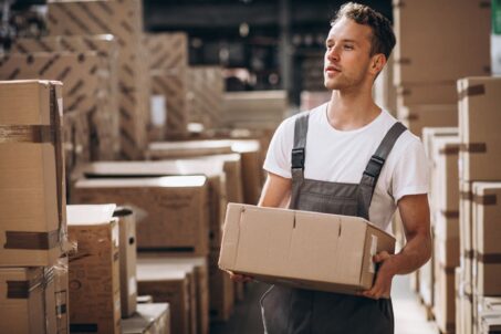 young-man-working-warehouse-with-boxes2